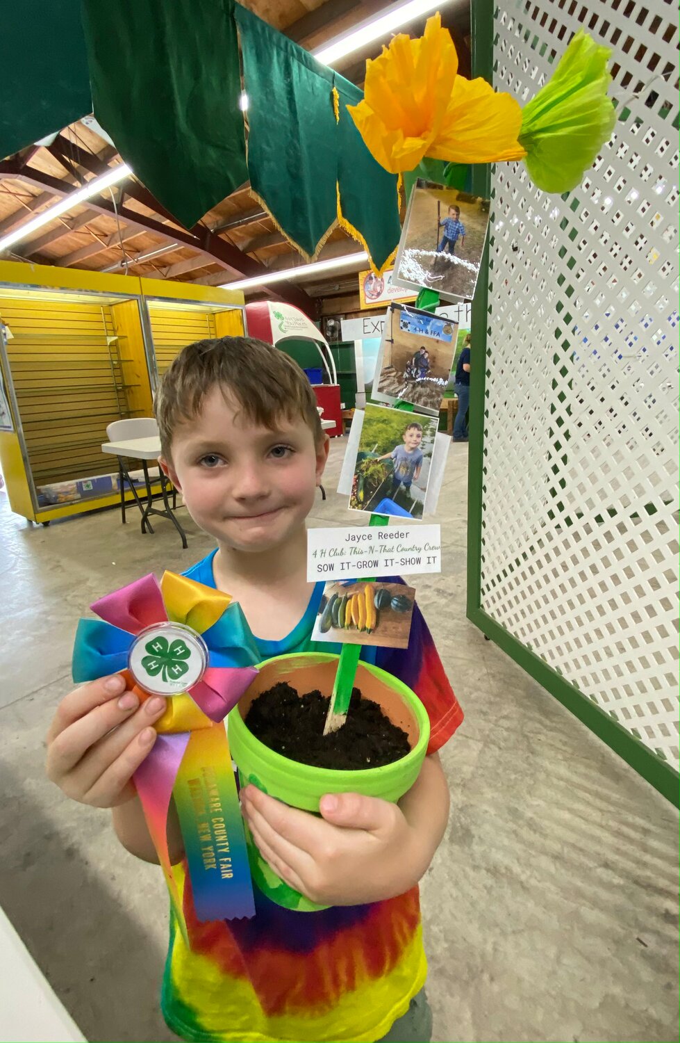 Jayce Reeder, 5, of Oxford, won a ribbon for his “Sow it-Grow it-Show it” flower pot exhibit at the Delaware County Fair, Sunday, Aug. 13.